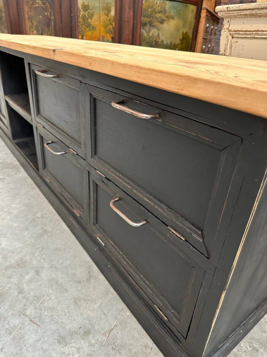 Old workshop furniture transformed into a TV unit.