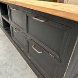 Old workshop furniture transformed into a TV unit.