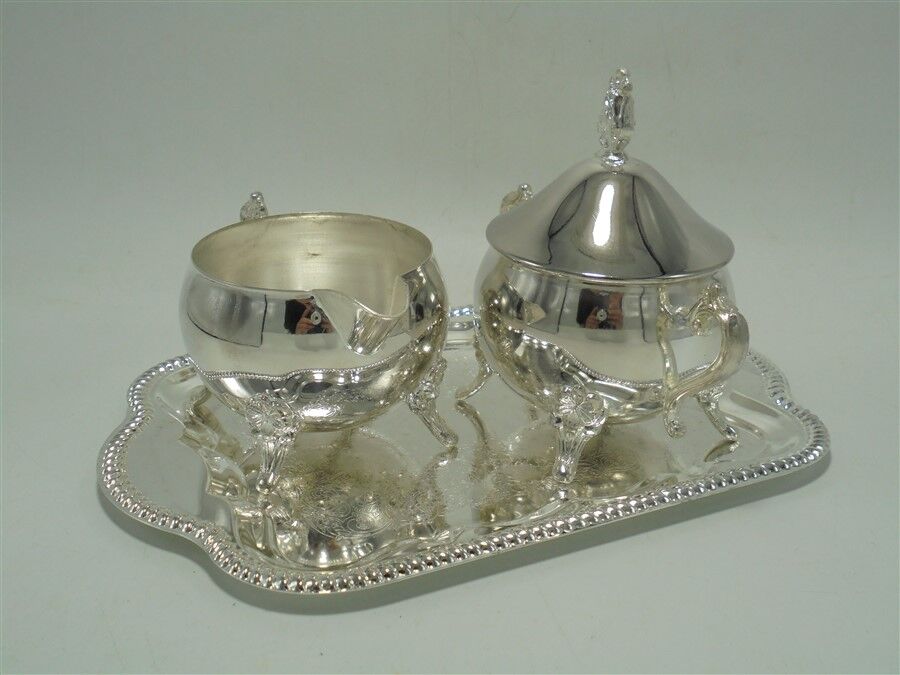 Sugar bowl and milk jar on tray