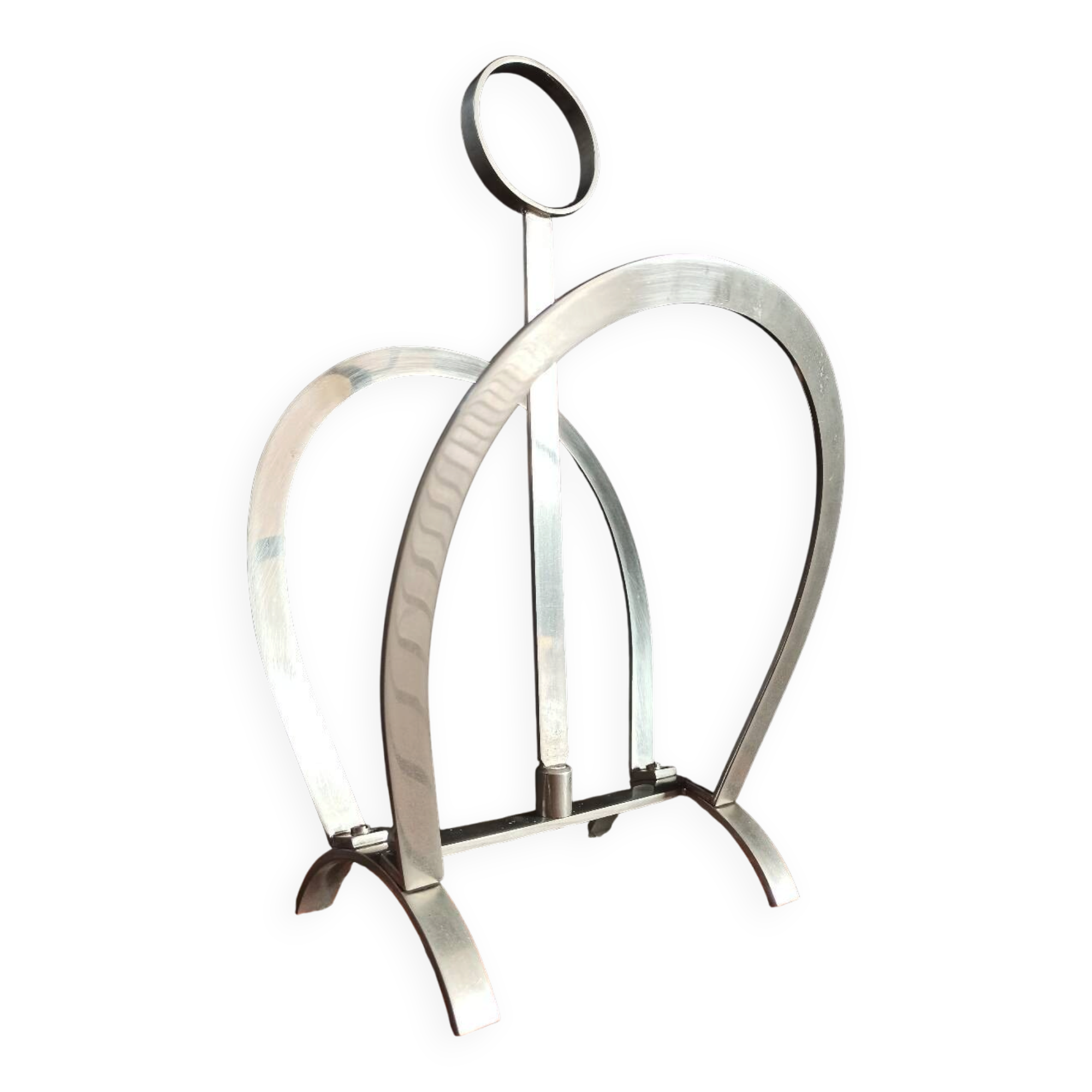 Vintage magazine rack in shiny stainless steel