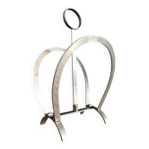 Vintage magazine rack in shiny stainless steel
