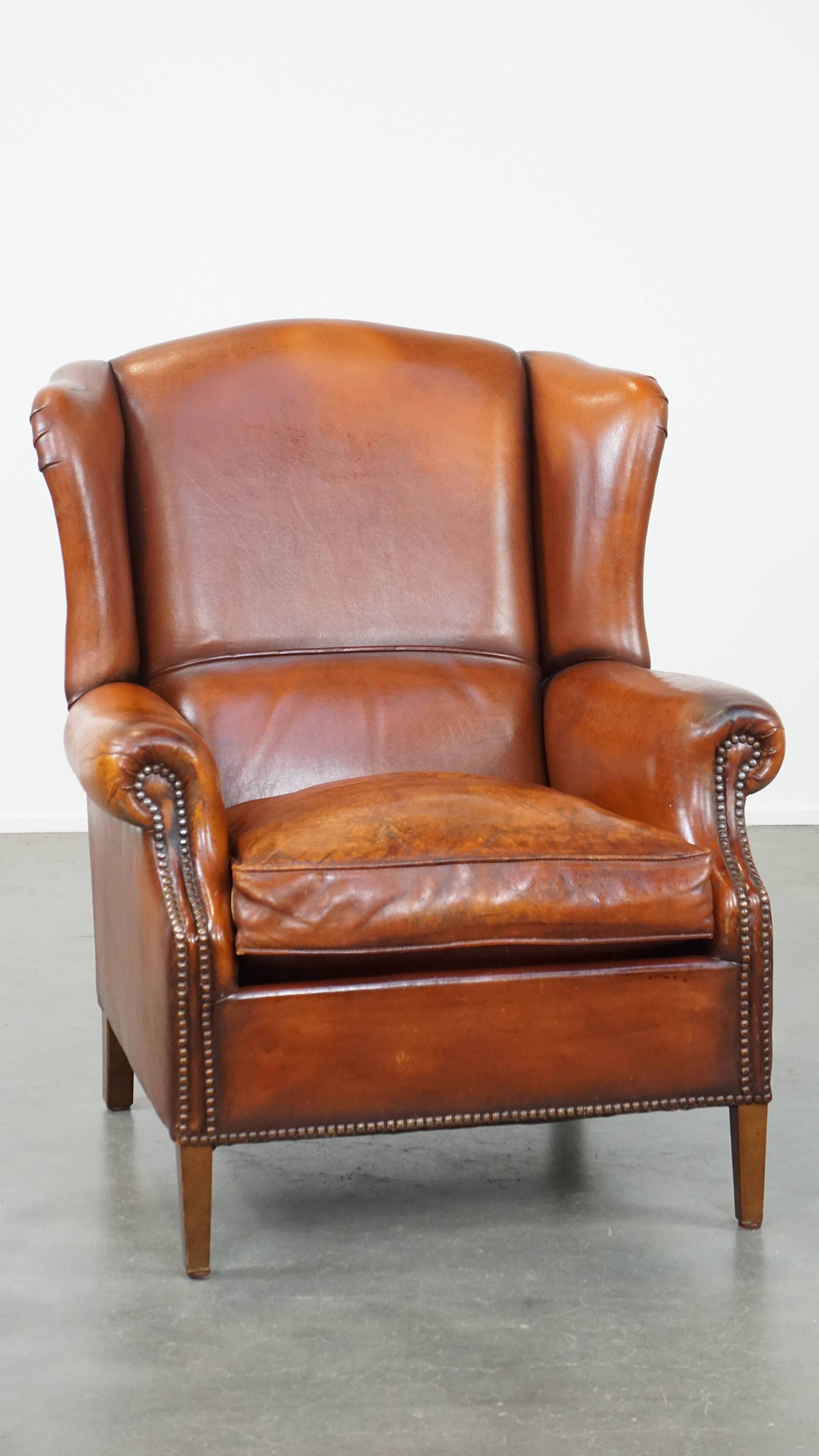 Sheepskin leather wingback chair with patina