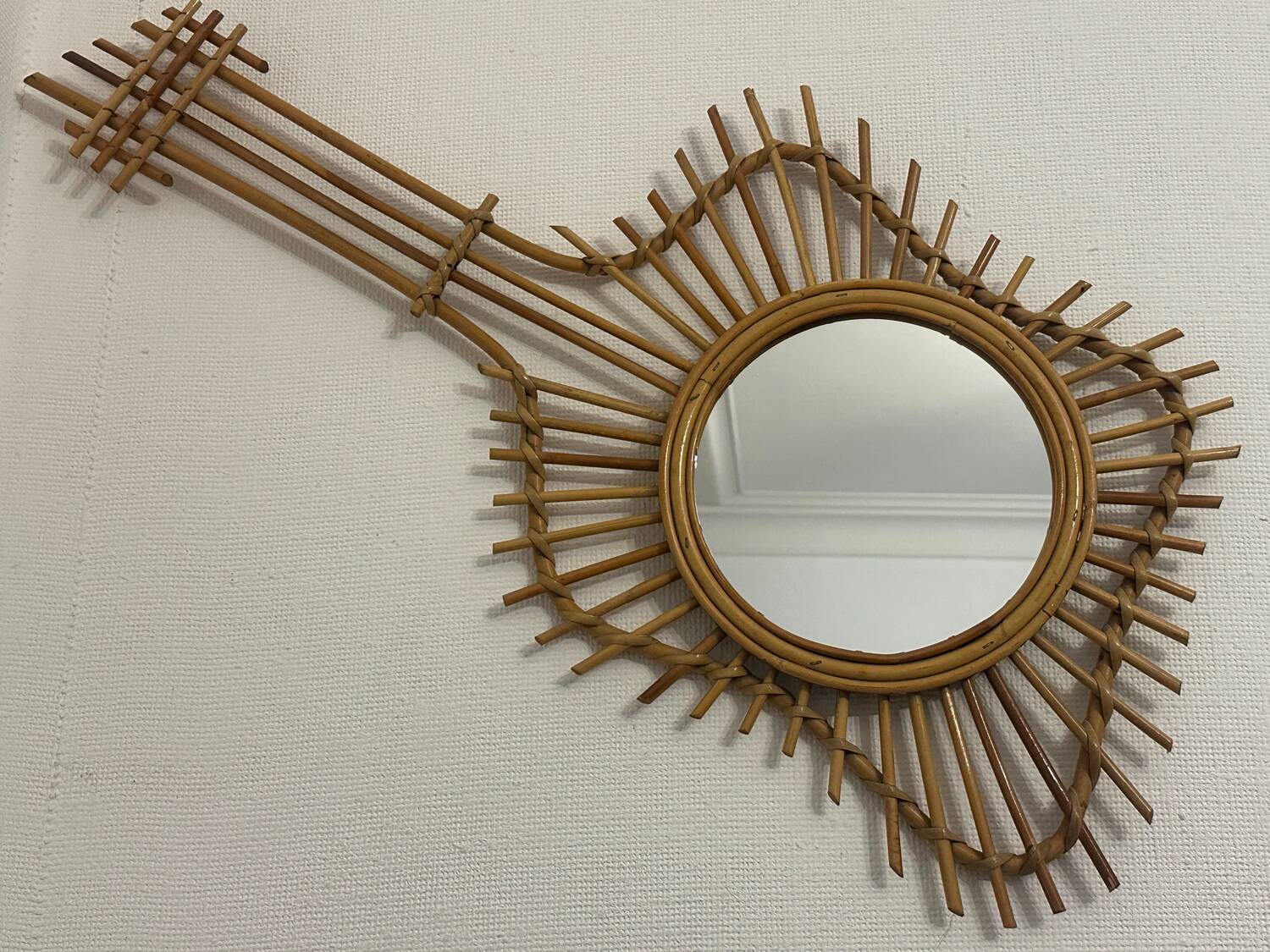 The vintage guitar rattan mirror.