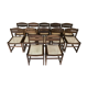 Set of 12 "sledge" dining chairs in walnut and cane.