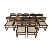 Ensemble de 12 chaises de salle à manger "traineau" en noyer et canne