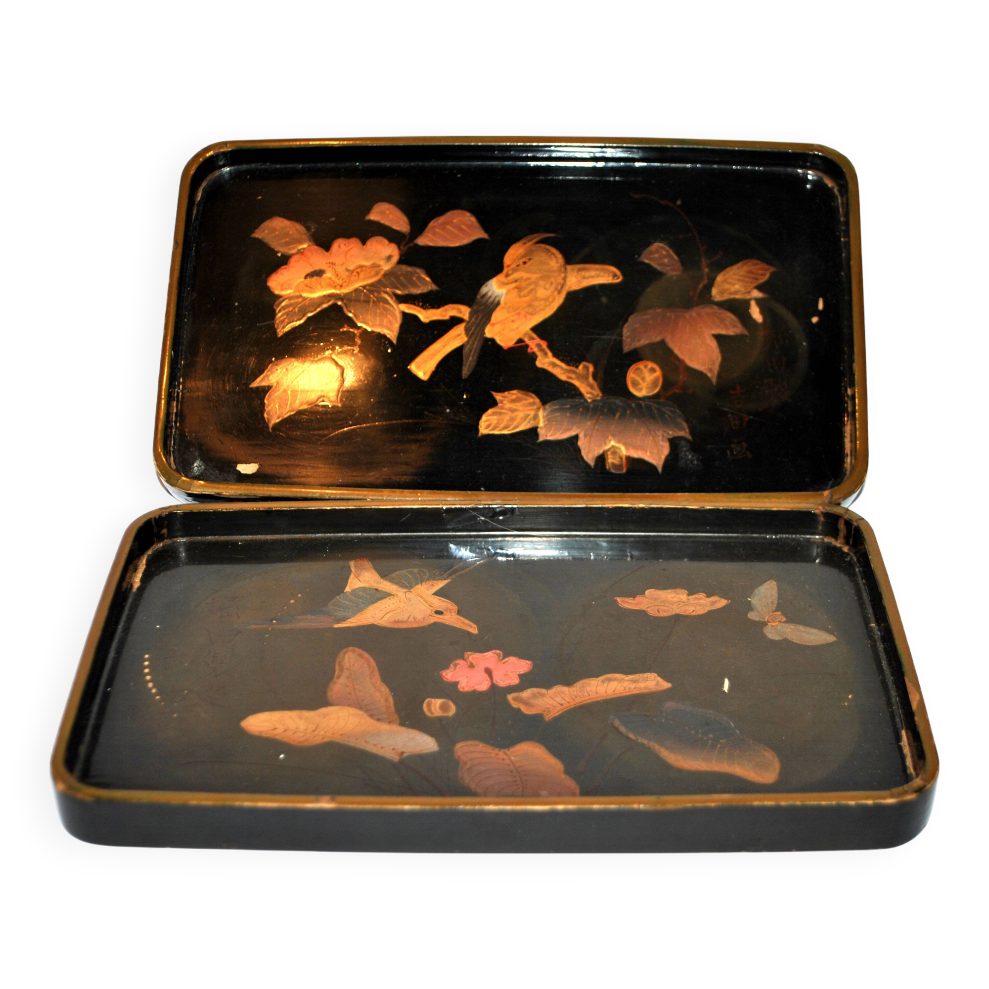 Set of two brown and black Chinese lacquer trays with bird decor