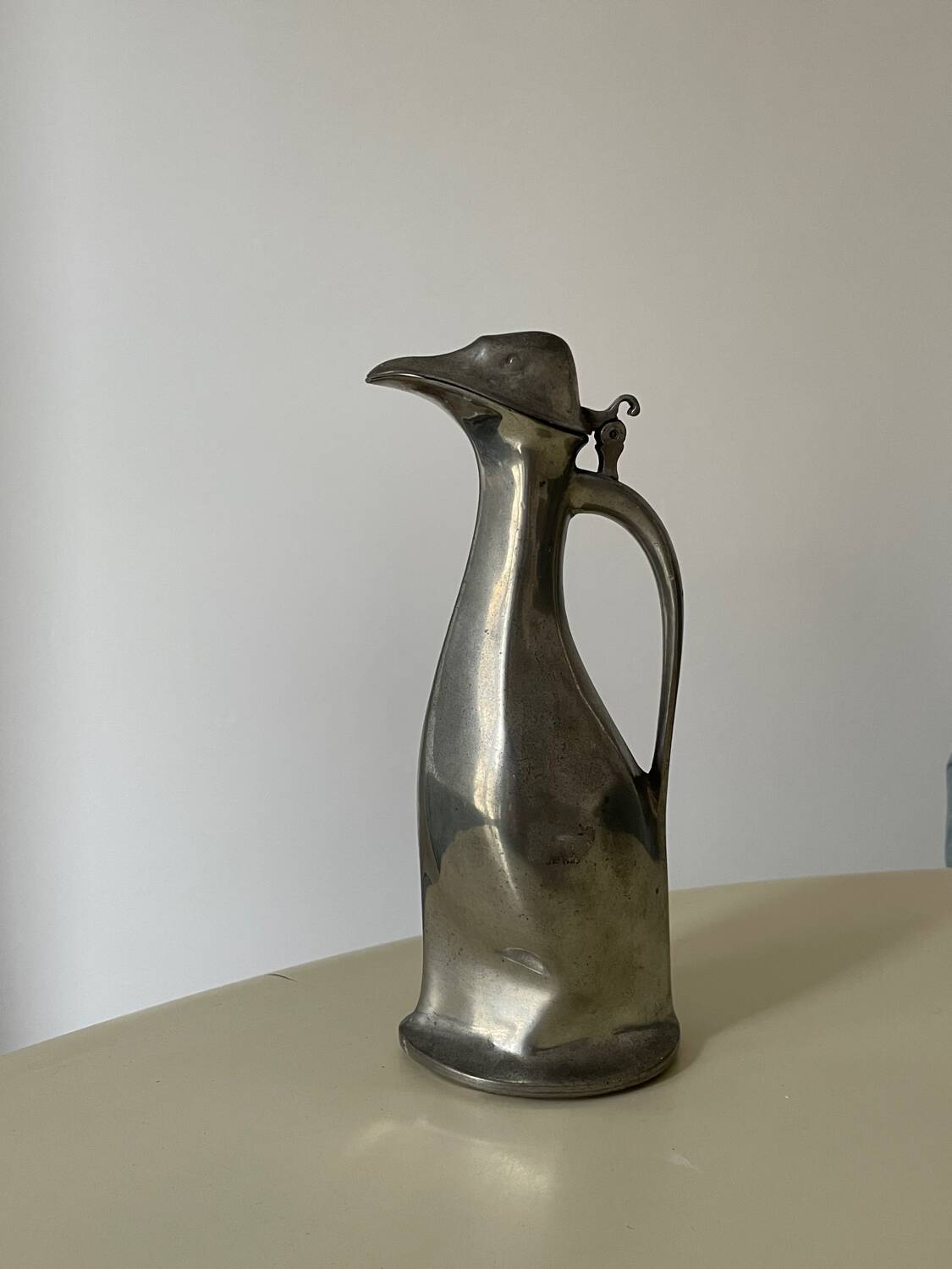 Polished pewter penguin-shaped carafe designed by Hugo Leven for Kayserzinn