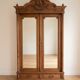 Antique solid wood wardrobe with mirror doors.