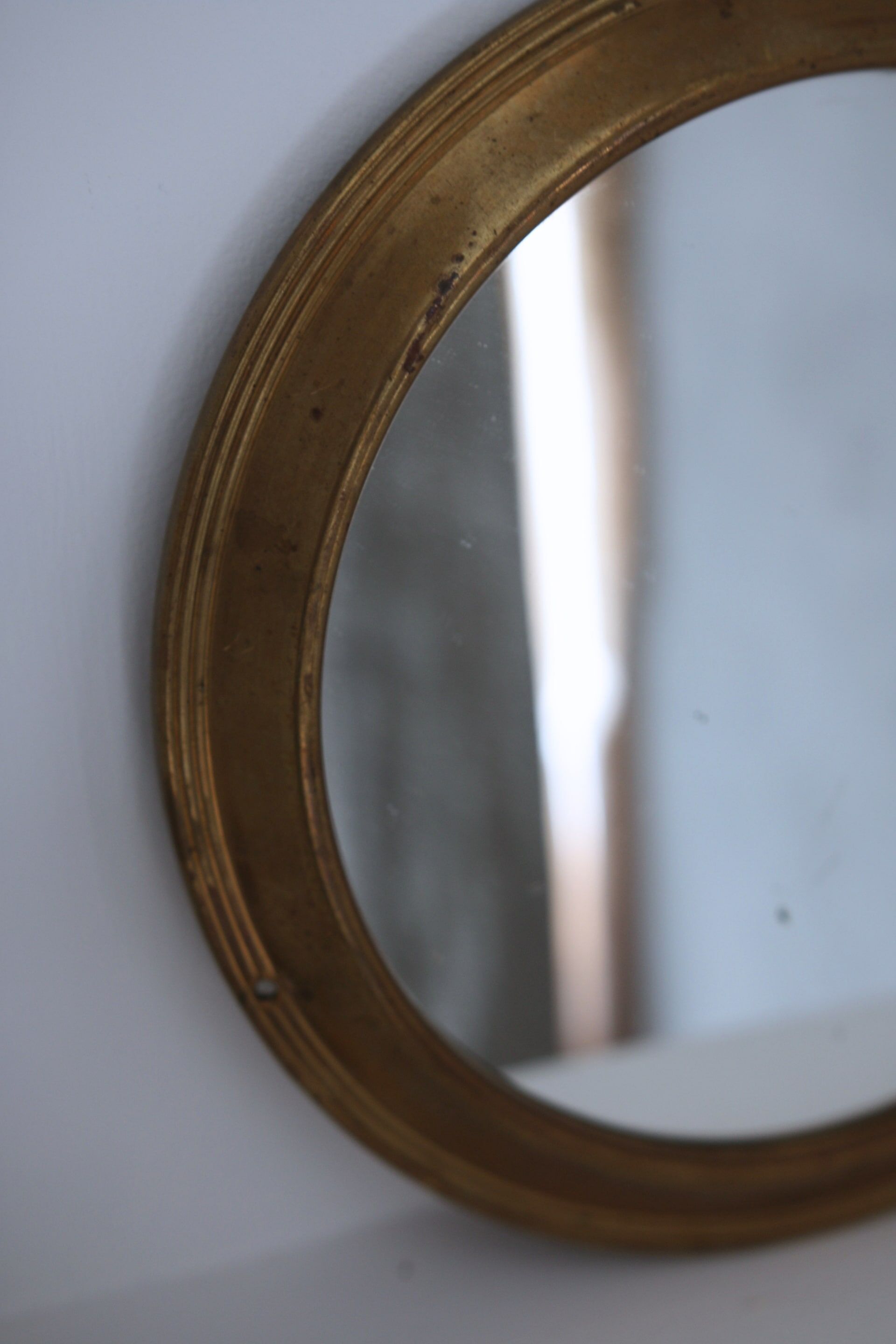 Antique round brass mirror