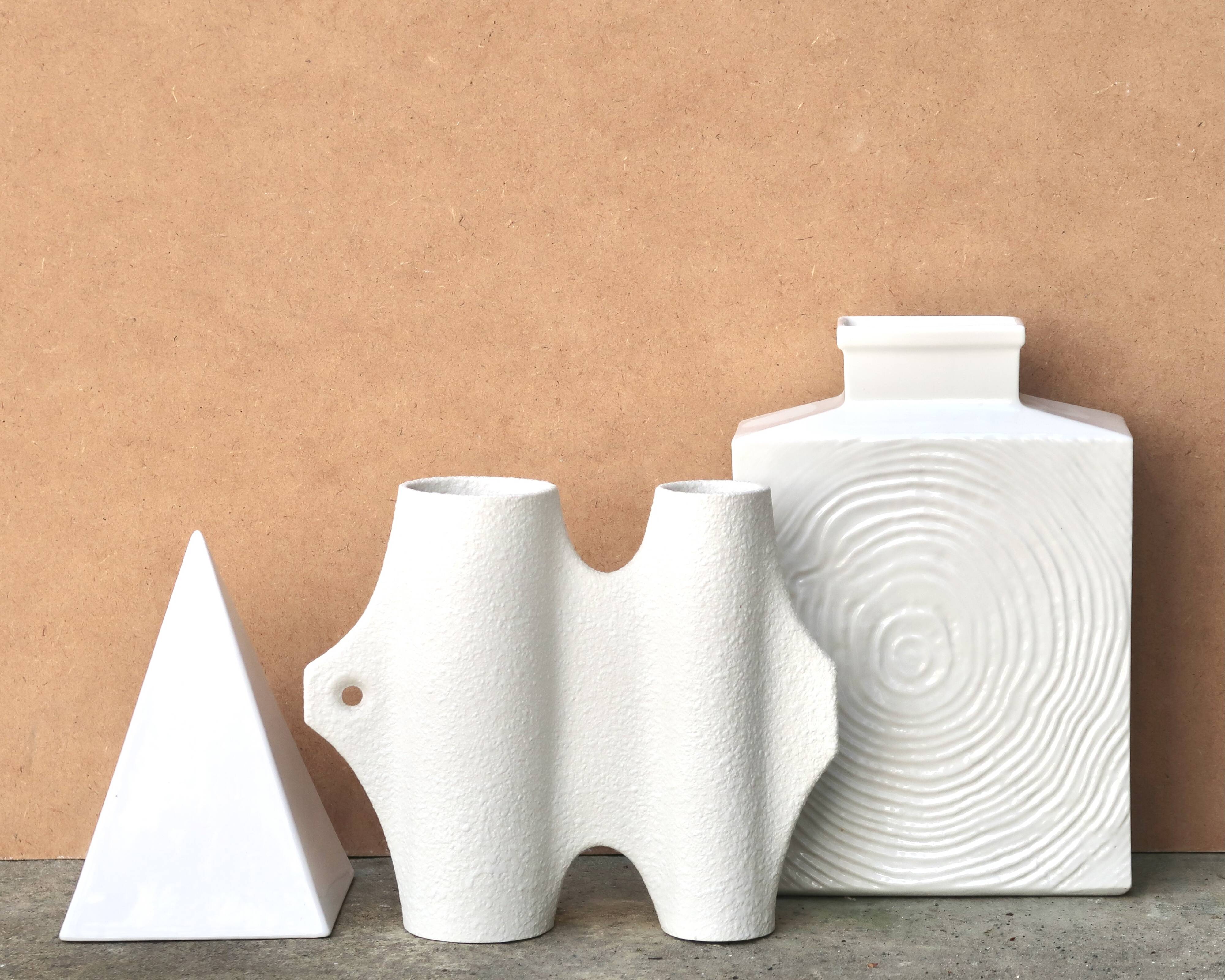 Minimalist white ceramic pyramid sculpture, 1970s.