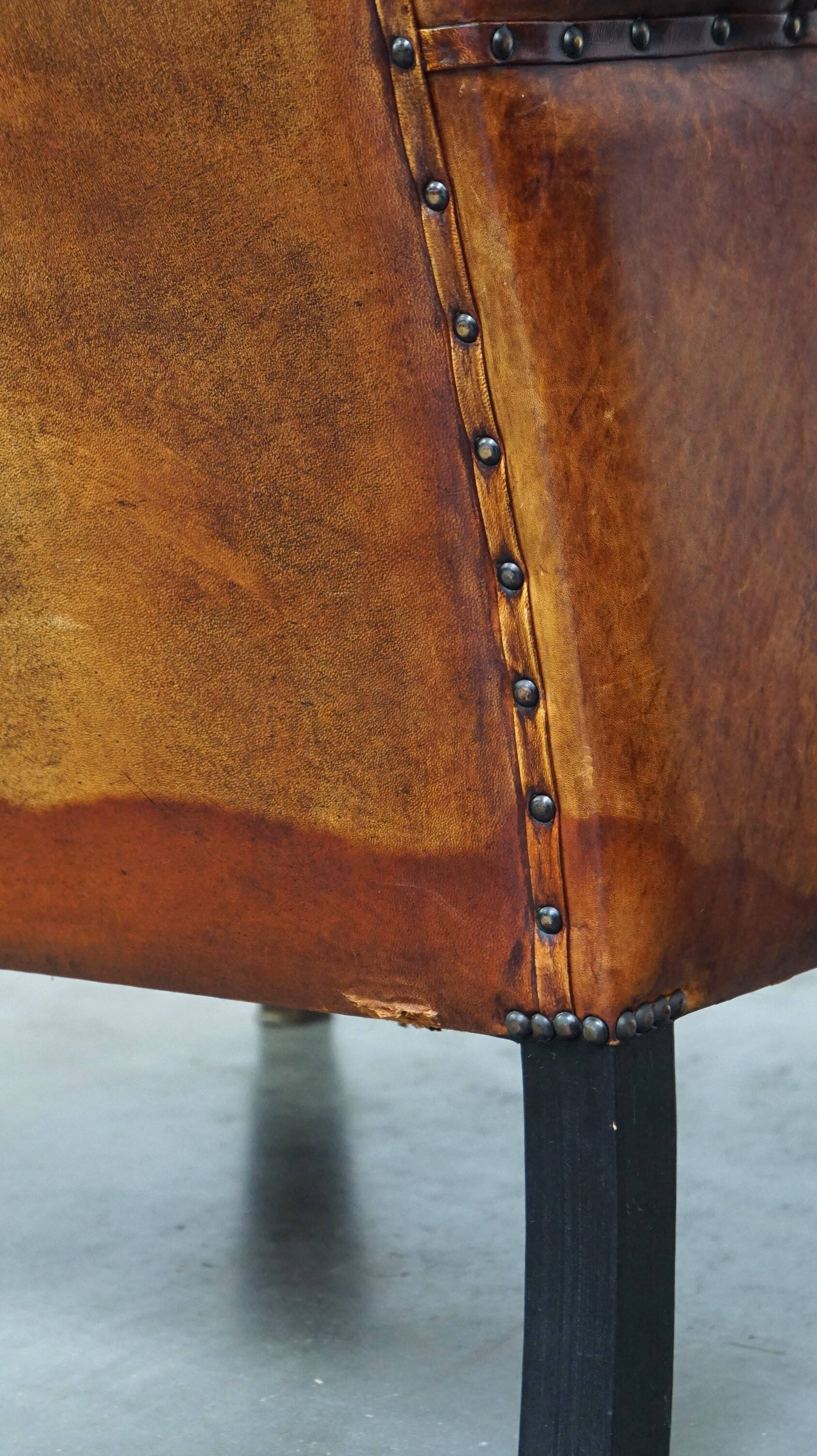 Sheepskin leather chair with a beautiful patina