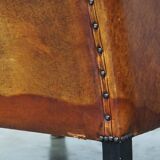 Sheepskin leather chair with a beautiful patina