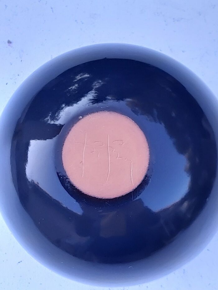 Signed ceramic flower-picker ball