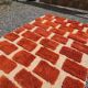 Large Moroccan Berber rug in orange and ecru wool, 400 x 300 cm.