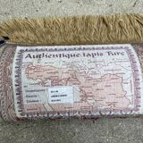 Vintage mechanical Turkish rug with box decoration on a red and navy blue background 139 x 68 cm