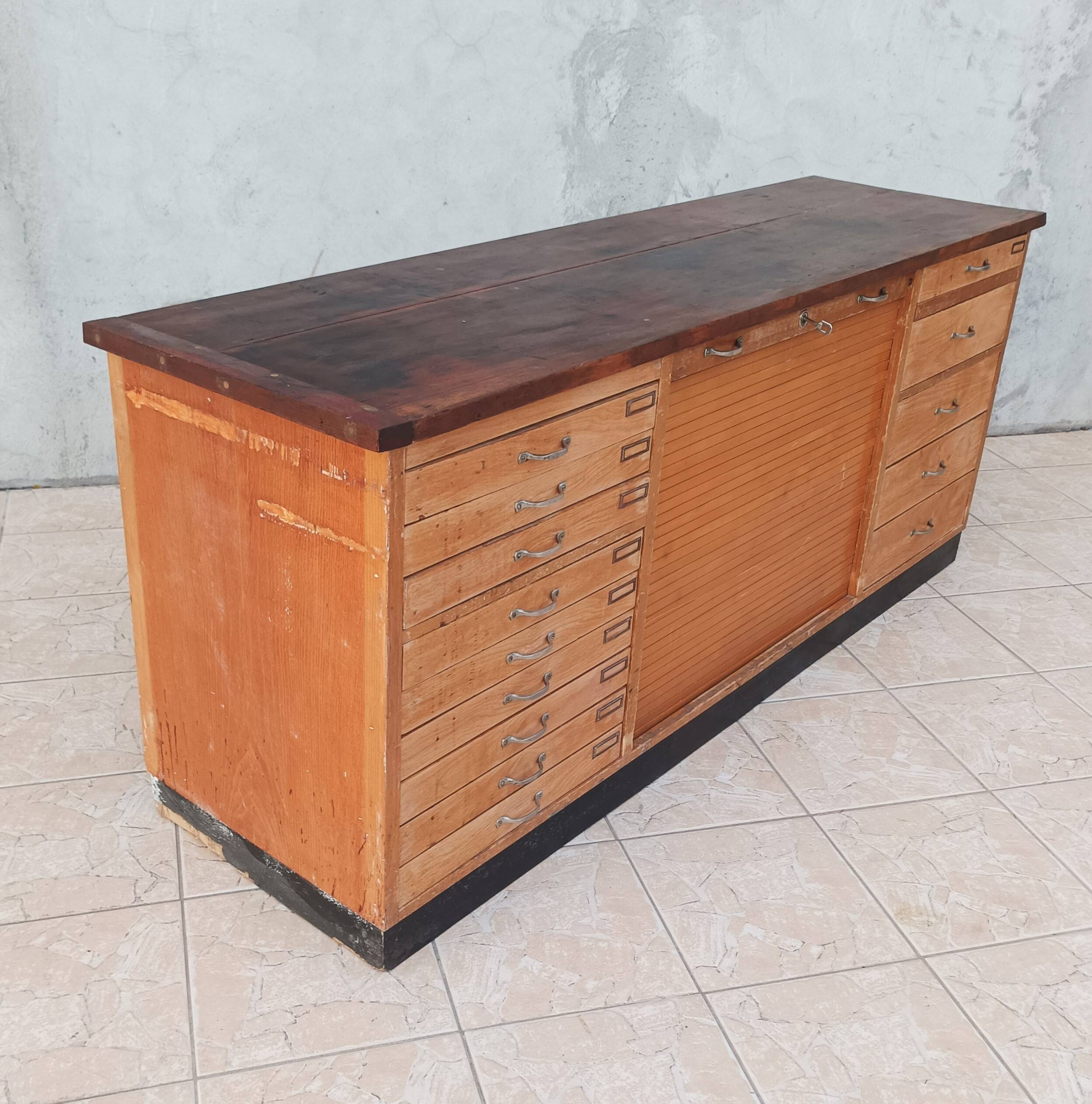 Workshop furniture with drawers and curtain in beech and walnut.