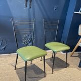 Pair of green vinyl chairs with black steel legs by Colette Gueden