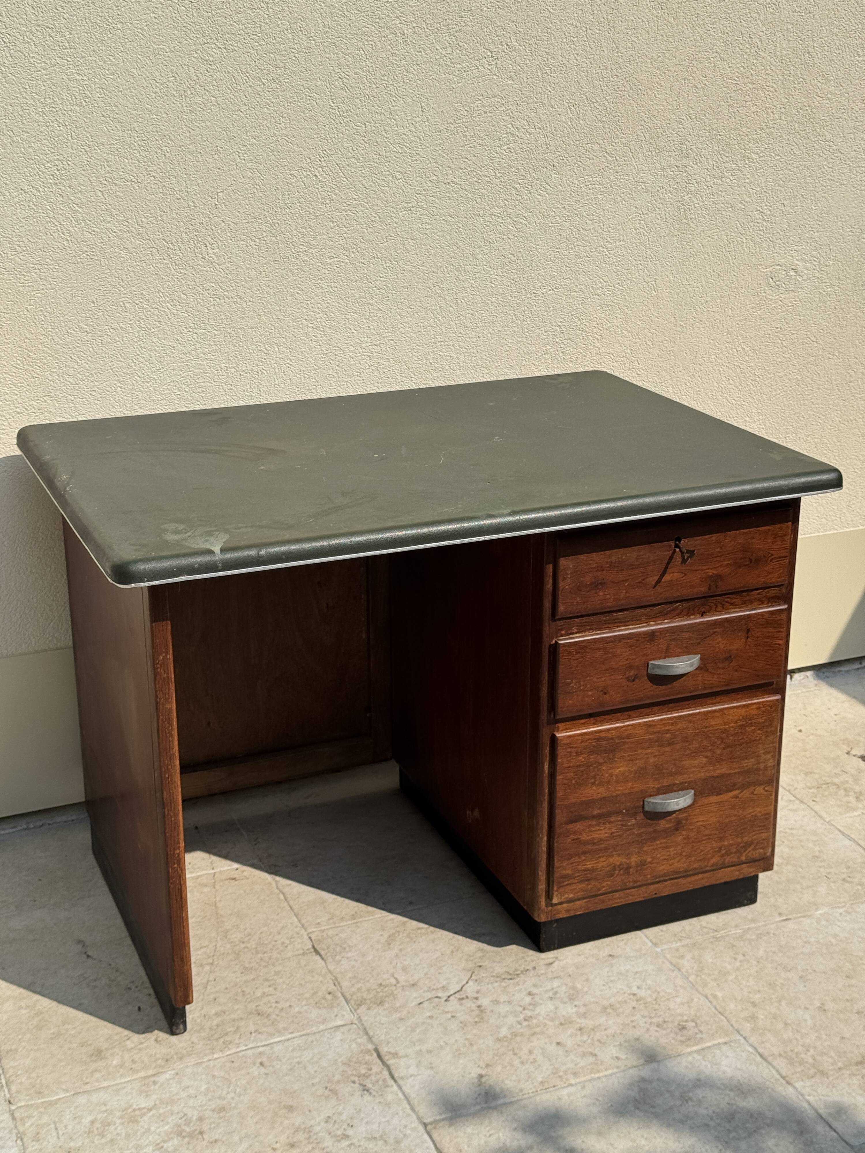 Modernist desk in wood and green moleskin upholstery
