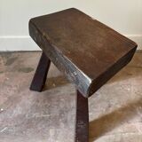 Brutalist tripod stool in dark wood