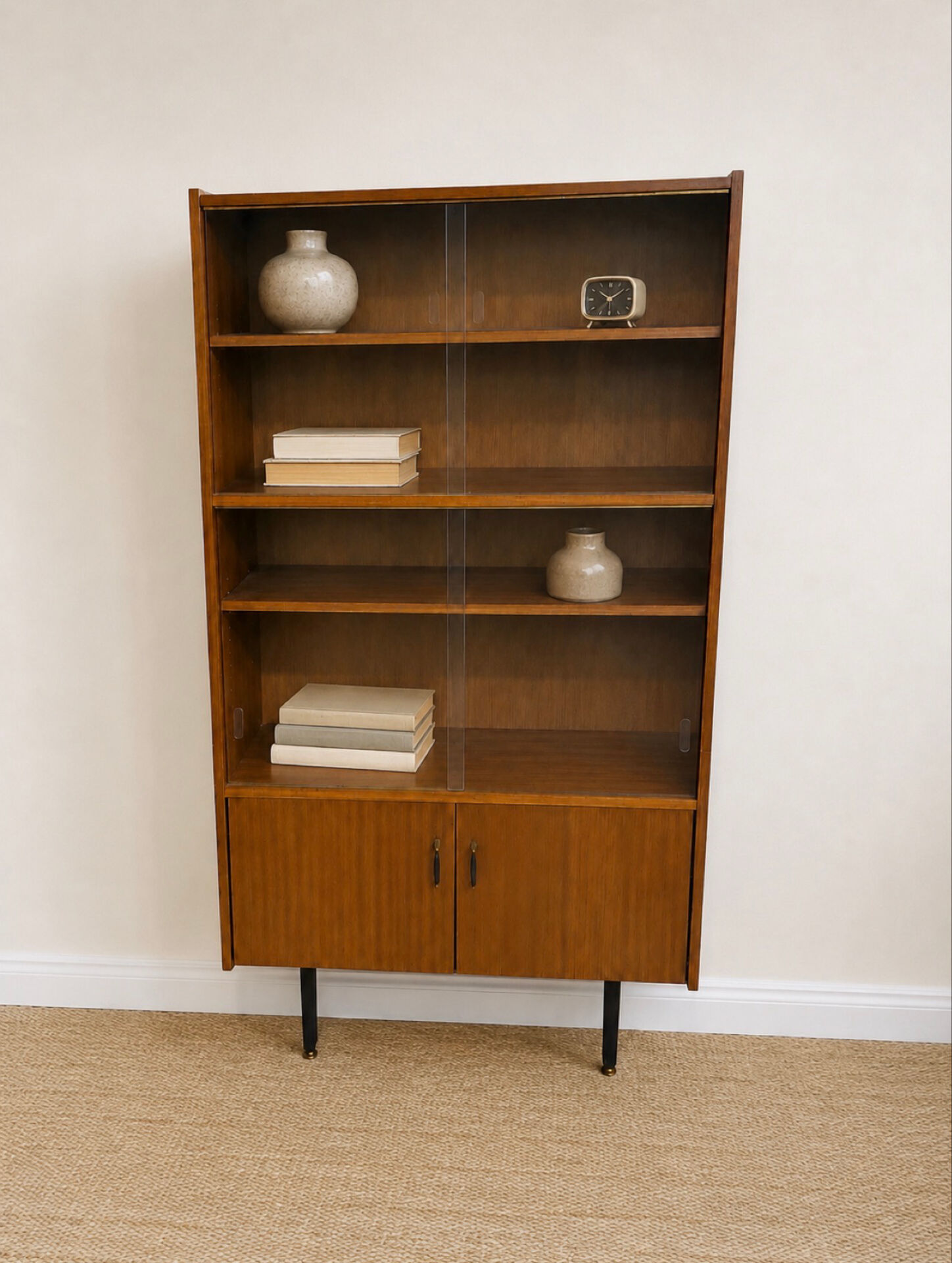 Modernist glass library from the 1960s in wood and black metal.