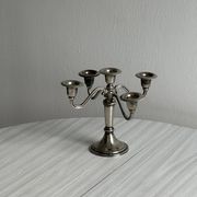 Candlestick candle holder in patinated silver metal