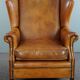 Wingback chair made of sheepskin leather in a light honey color