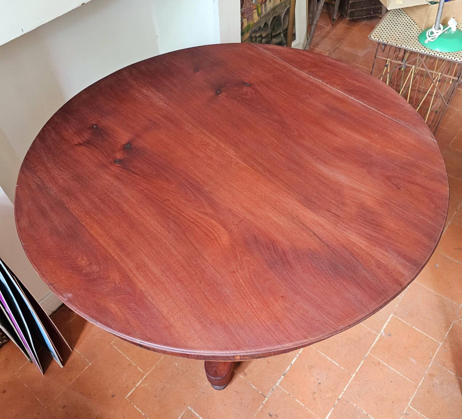 Round table with central tripod leg