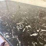 Console inlaid with black marble and lion's paw legs.