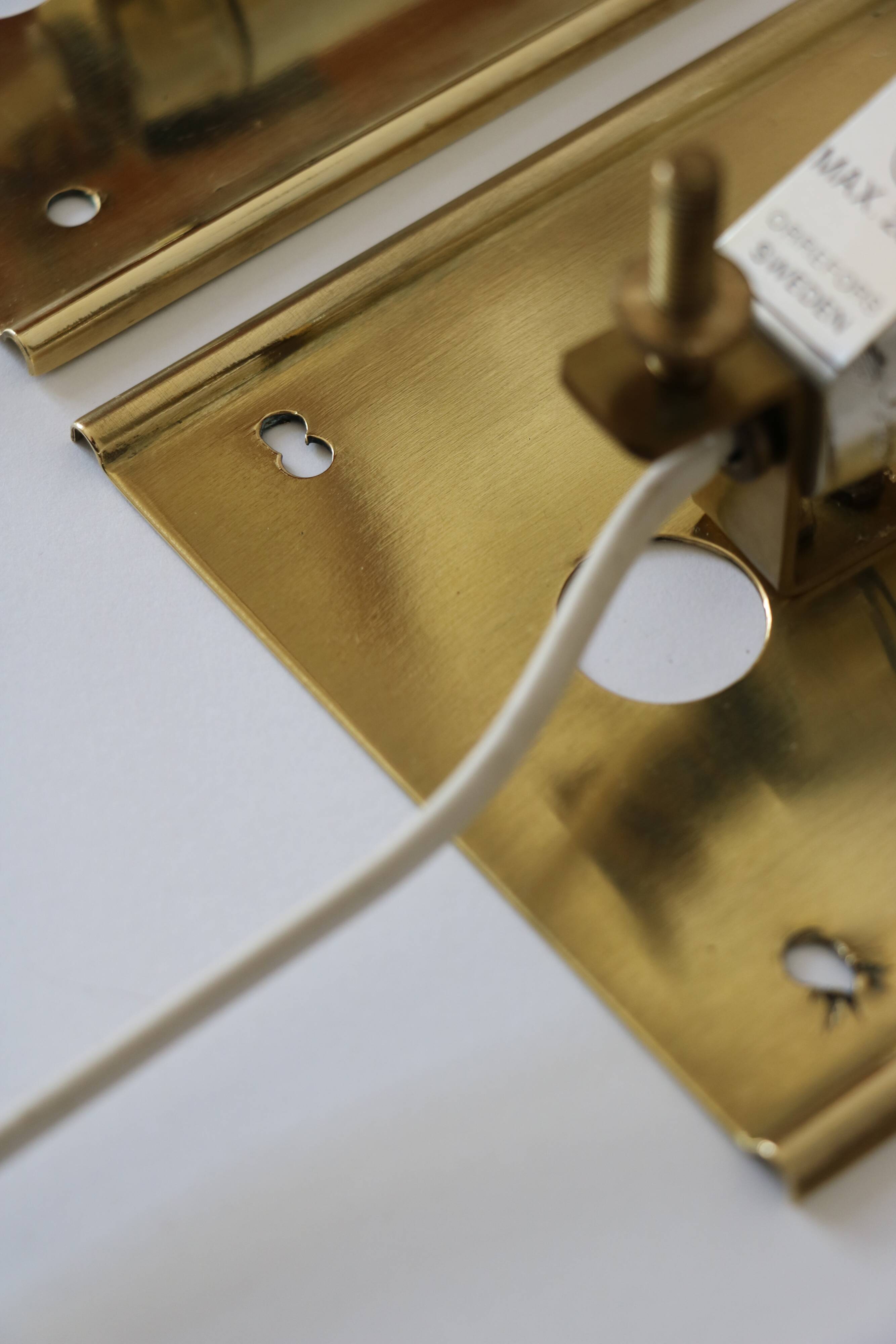 Pair of glass and brass wall lights by Carl Fagerlund for Orrefors.