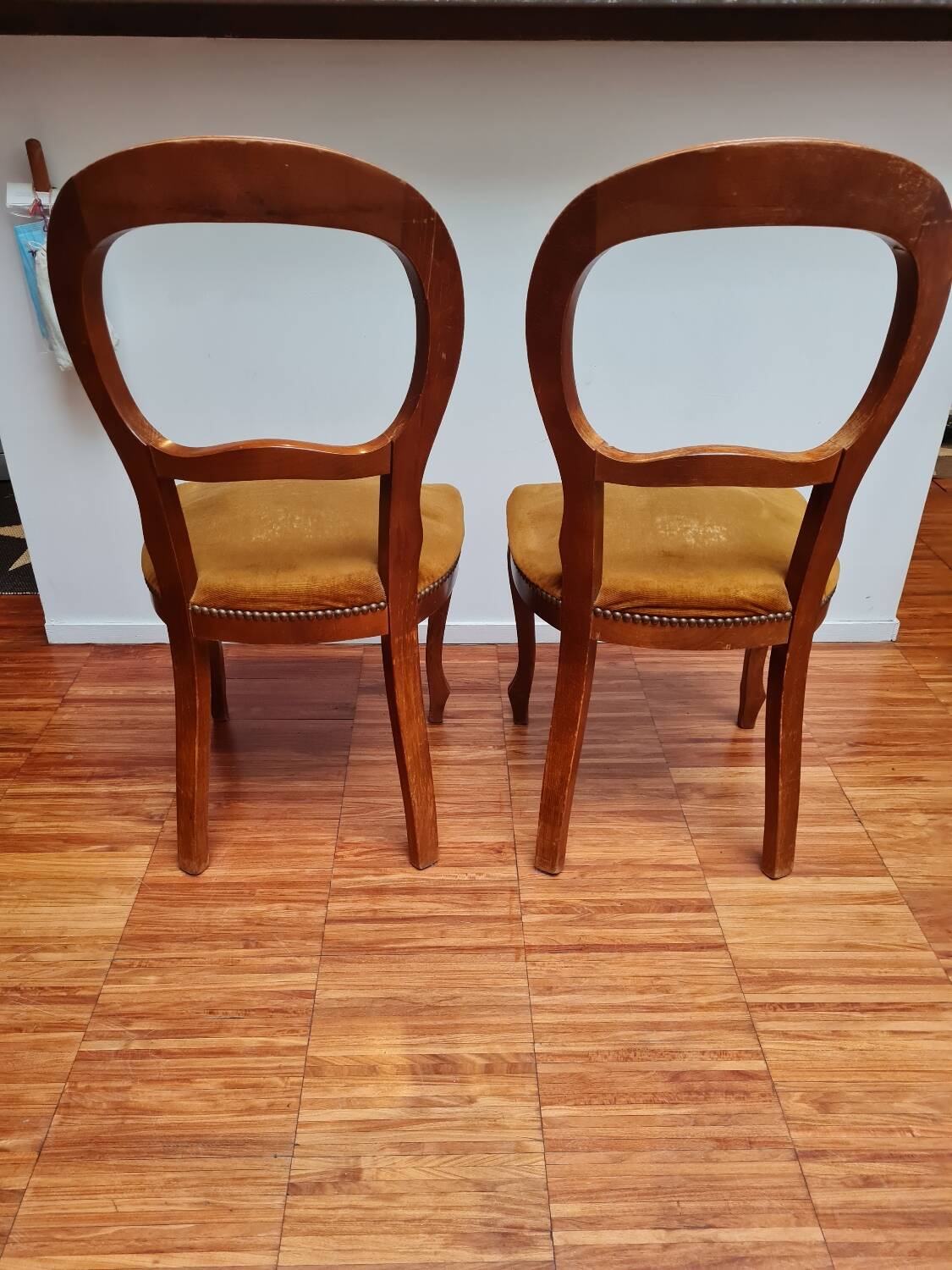 Pair of wooden chairs with velvet seats
