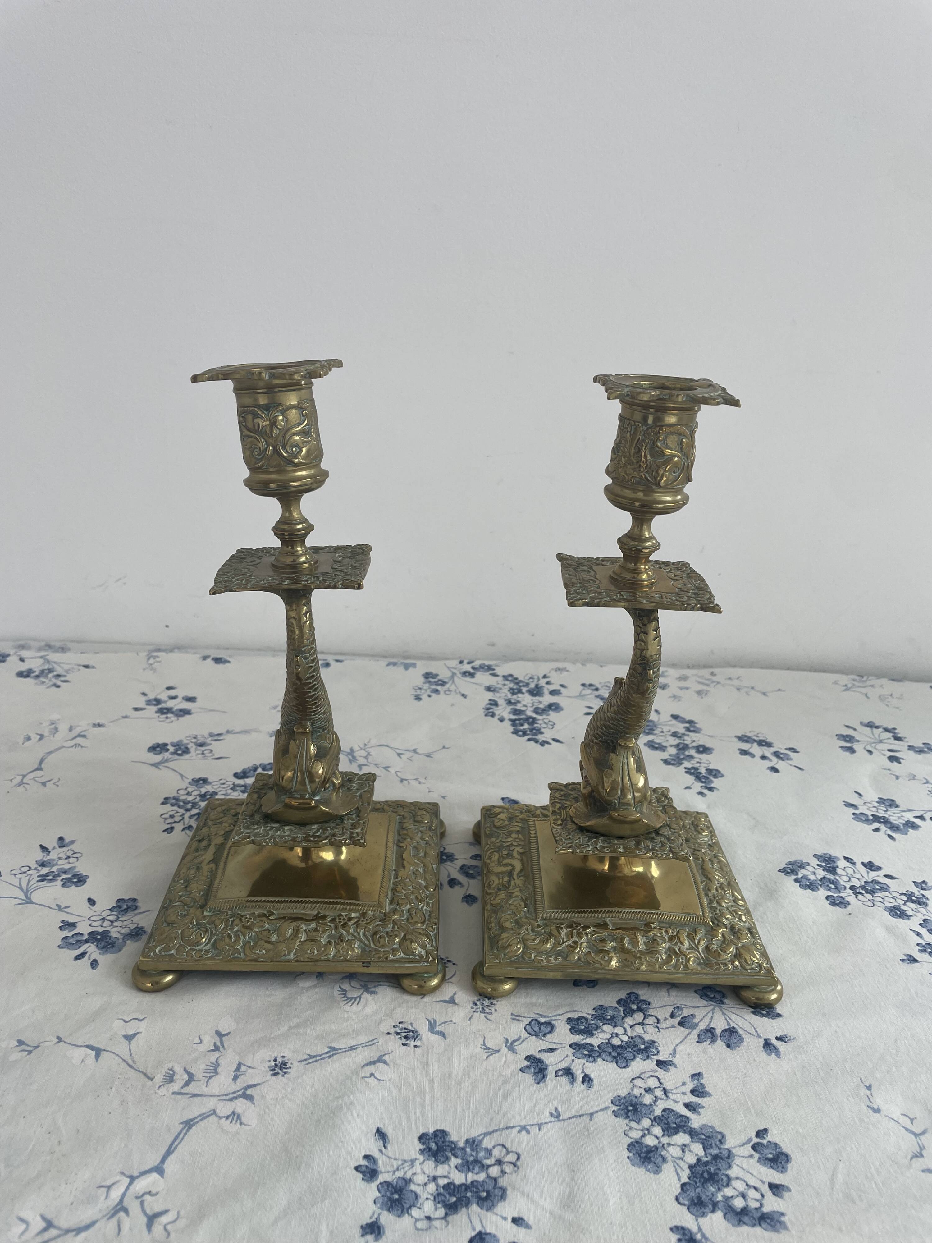 Pair of brass dolphin candlesticks, late 19th century, Napoleonic period