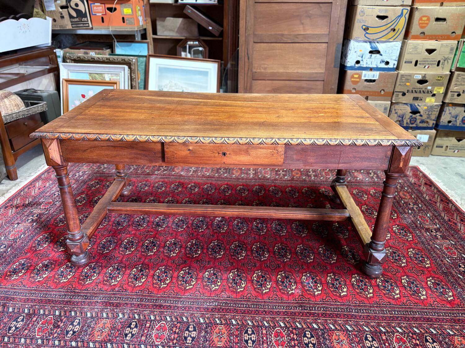 Large antique carved wooden desk in Renaissance style