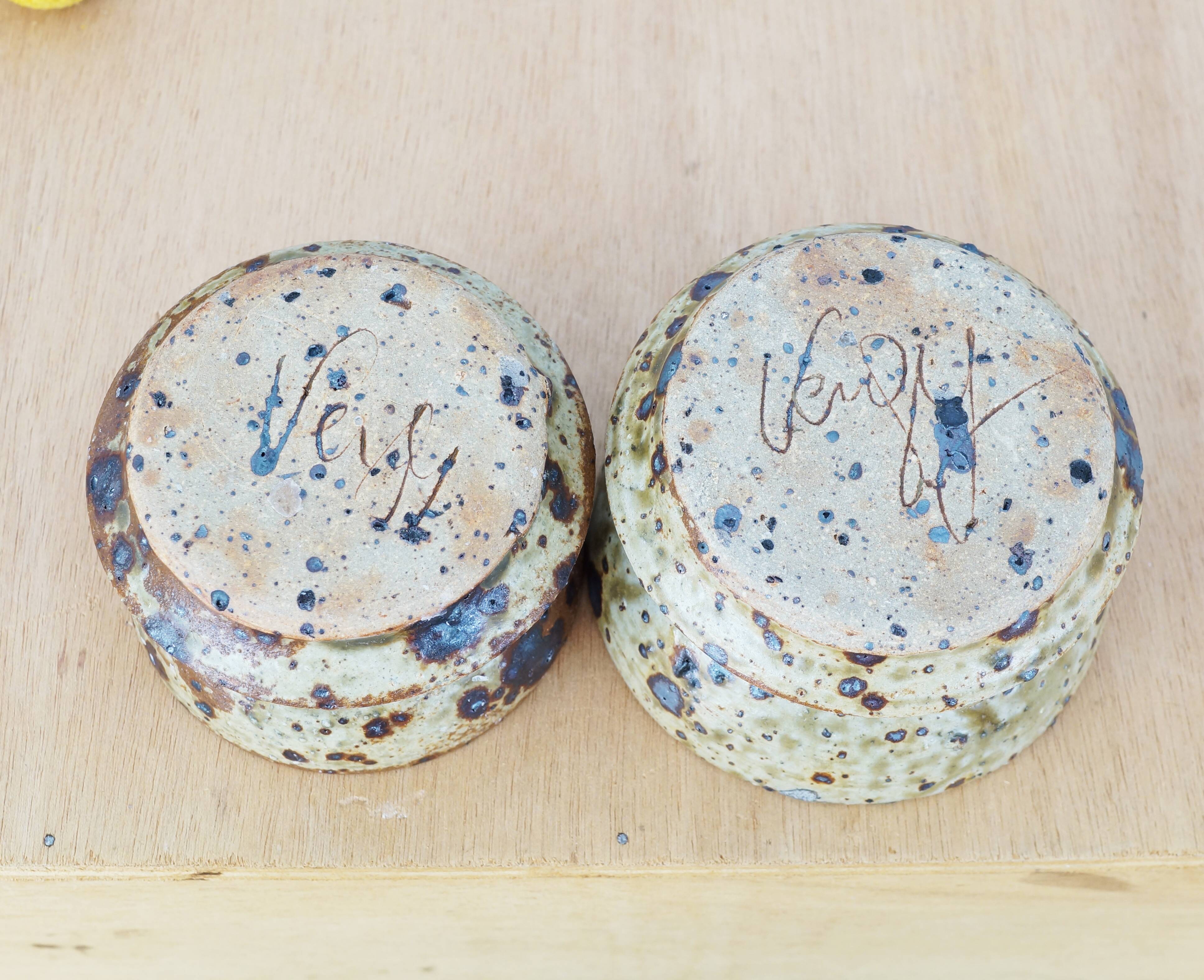 Pair of vergy speckled sandstone candle holders, vintage