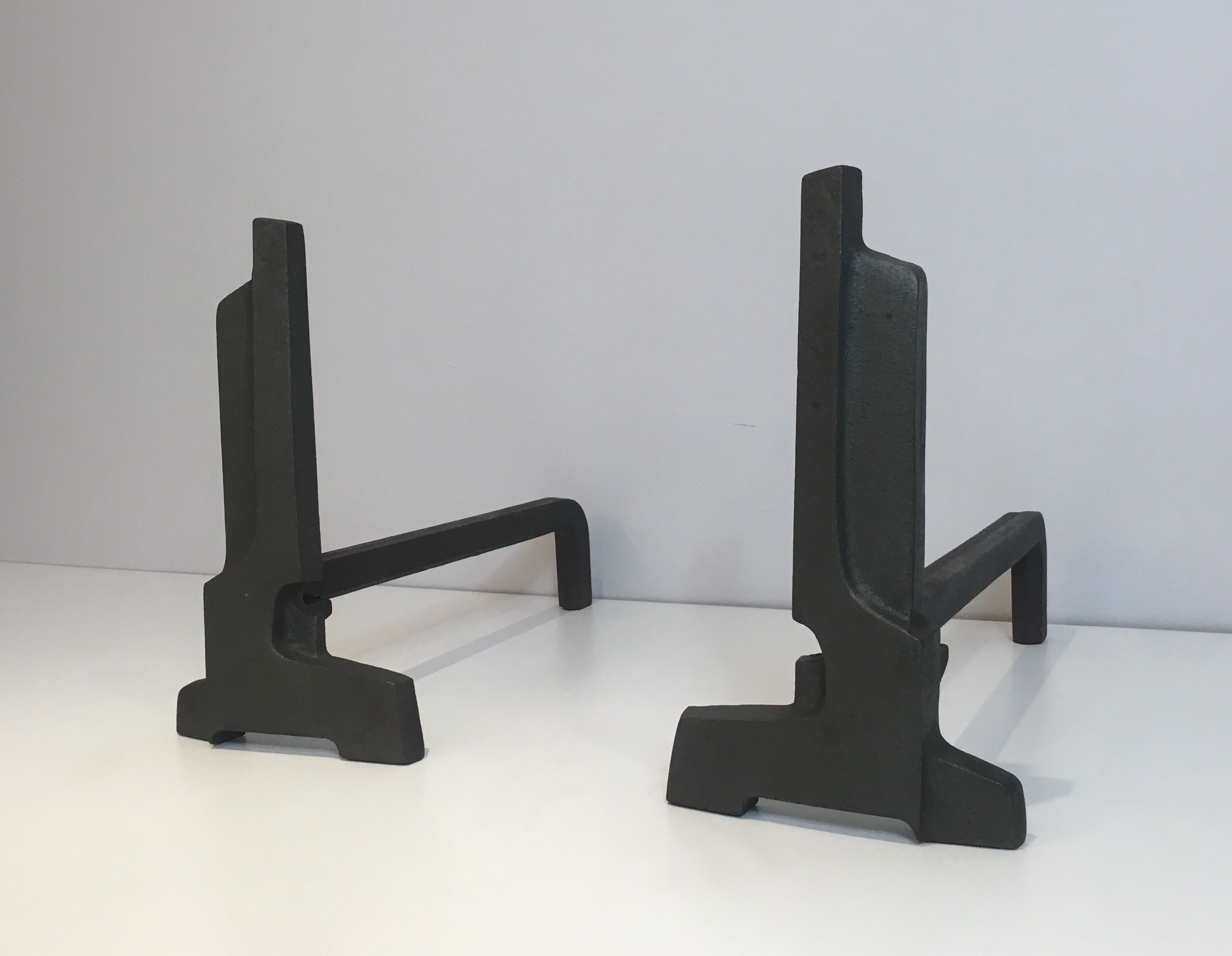 Pair of modernist chenets in cast iron and iron