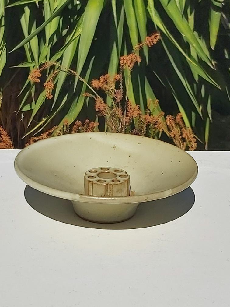 Taizé flower picket cut in sandstone