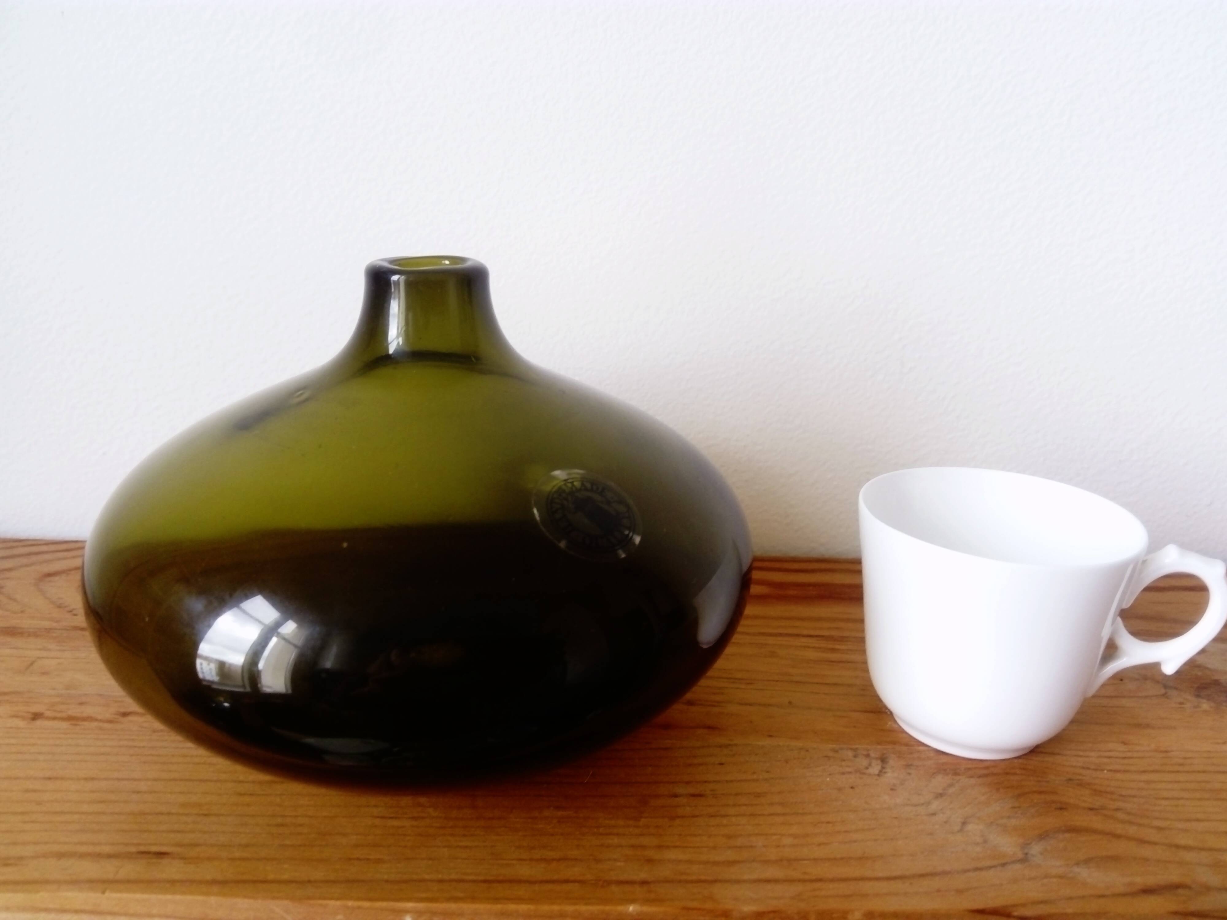 Small dark green handmade glass ball vase