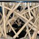 Table basse sculptural bois et verre
