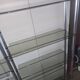 Large vintage double bookshelf from the 70s with chrome and smoked glass.