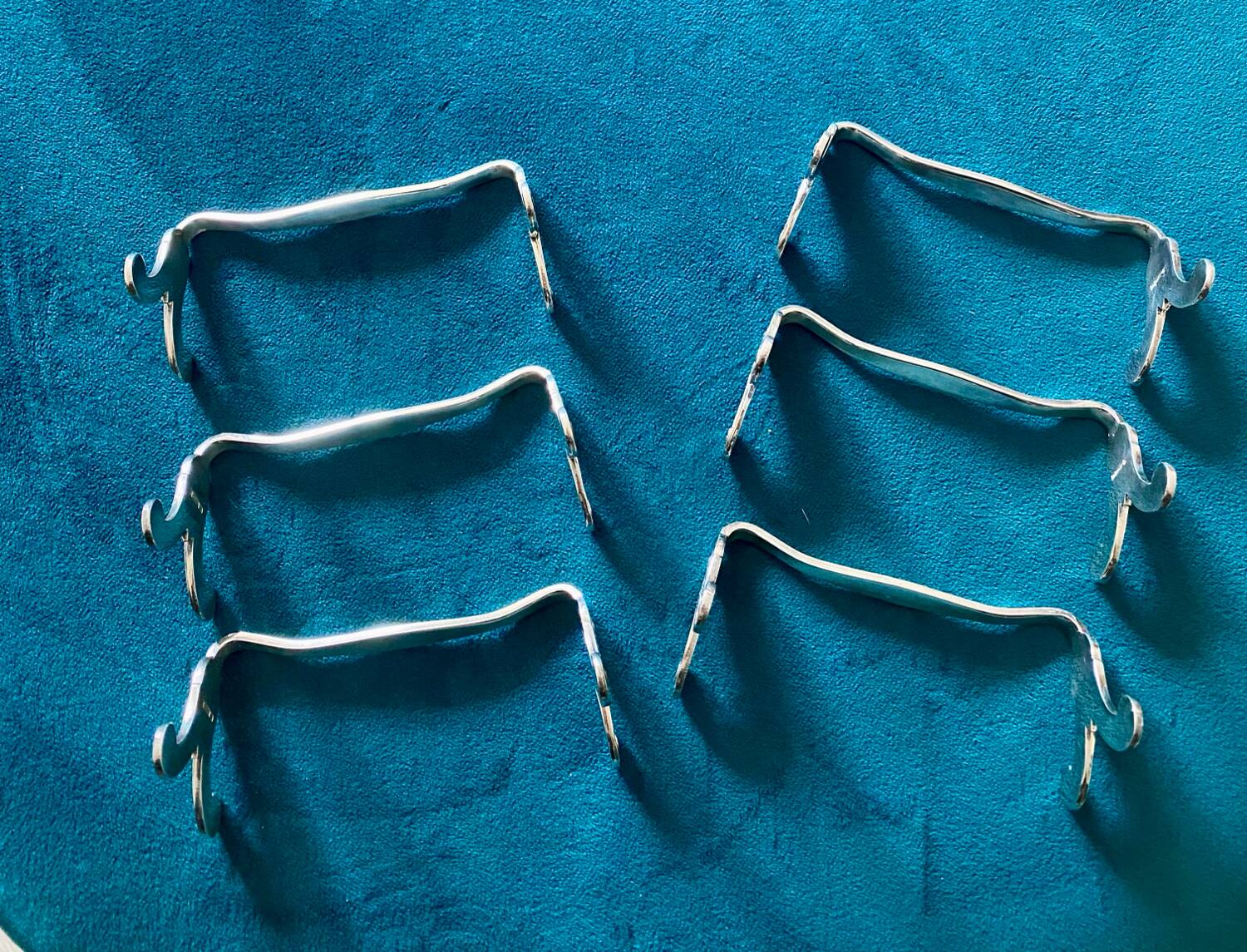6 Christofle silver-plated metal knife rests