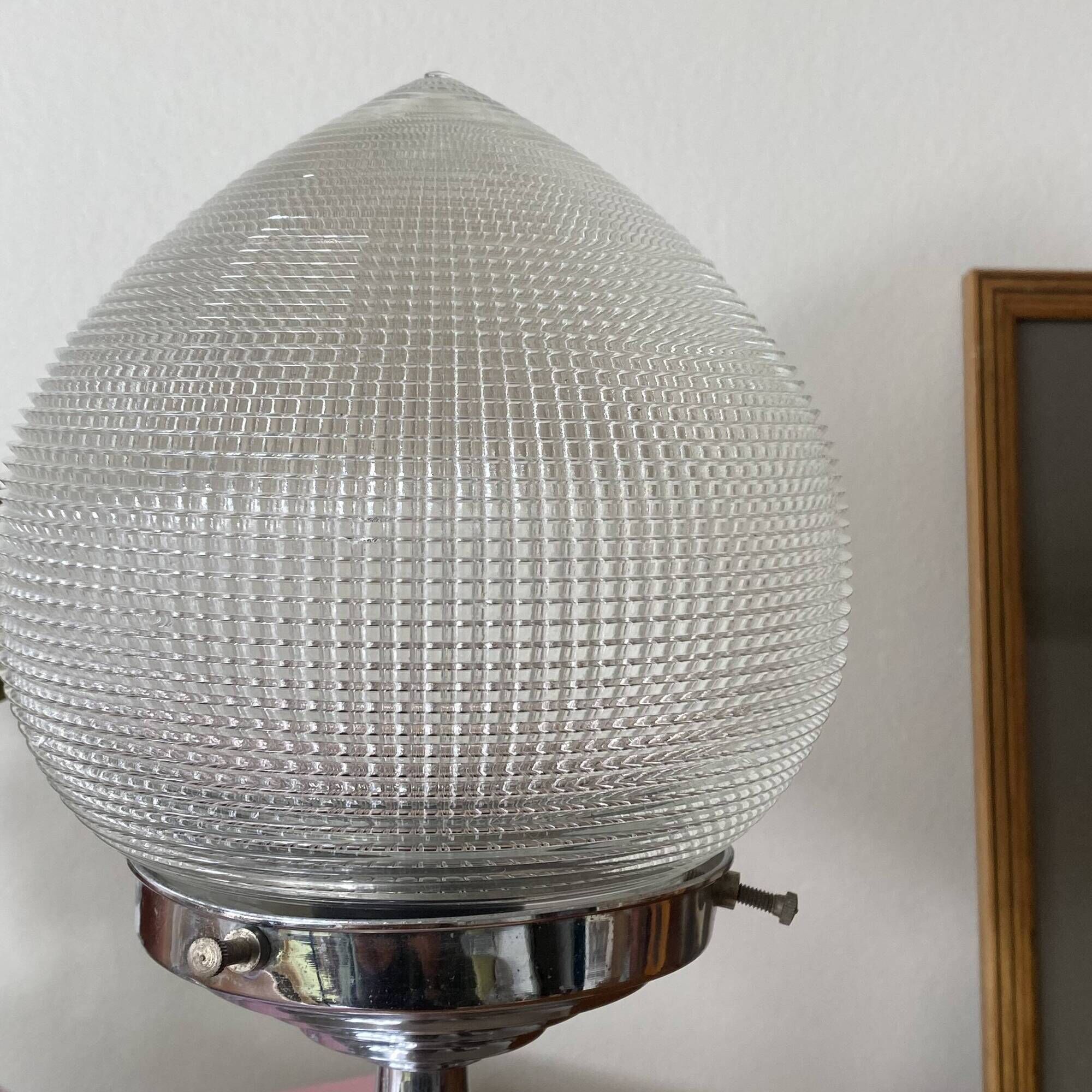 Antique lamp with a glass globe in Holophane style and chrome metal.