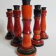 Set of five wooden candlesticks turned in the colors of "Pompeï"