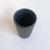 Matte black scroll vase by Antonio Lampecco