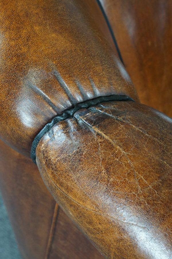 Club armchair in warm coloured sheepskin