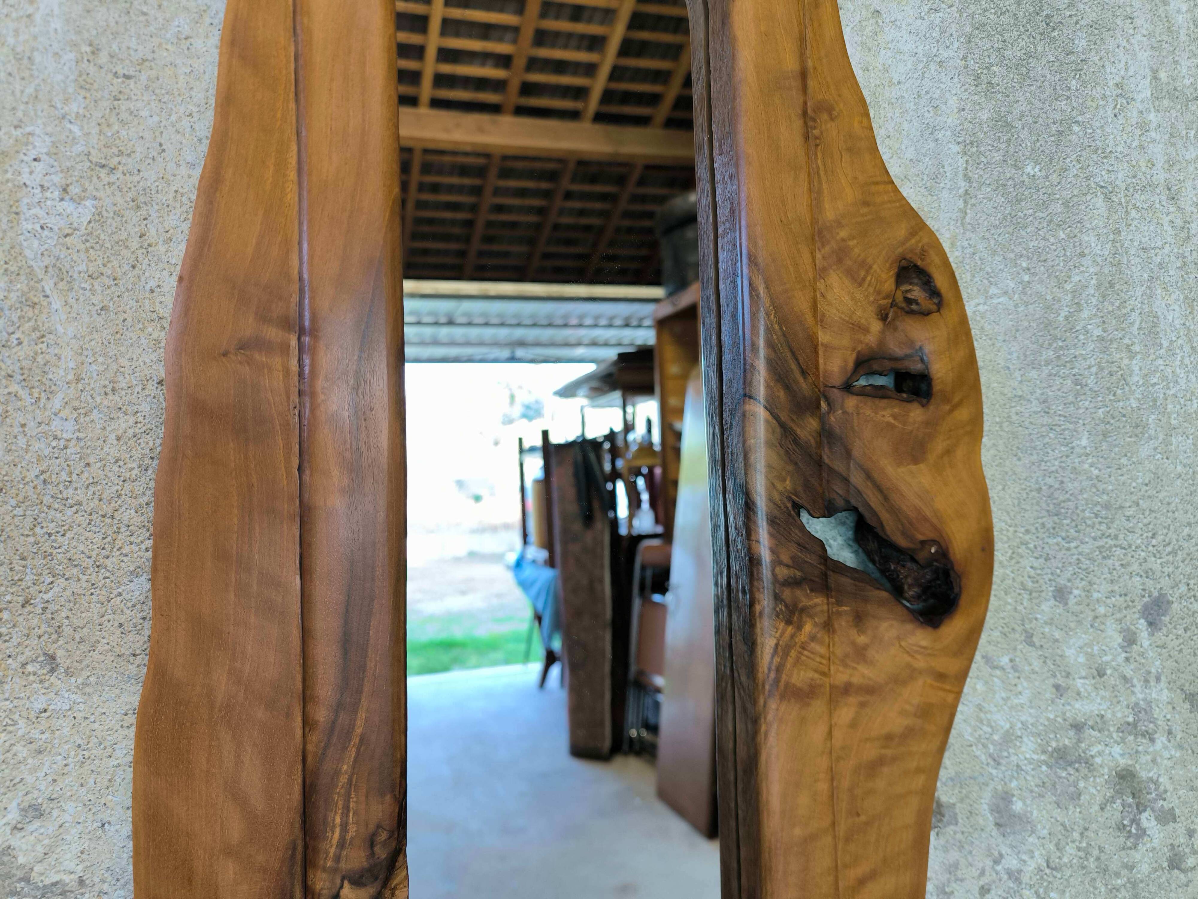 Vintage free-form mirror in solid wood.