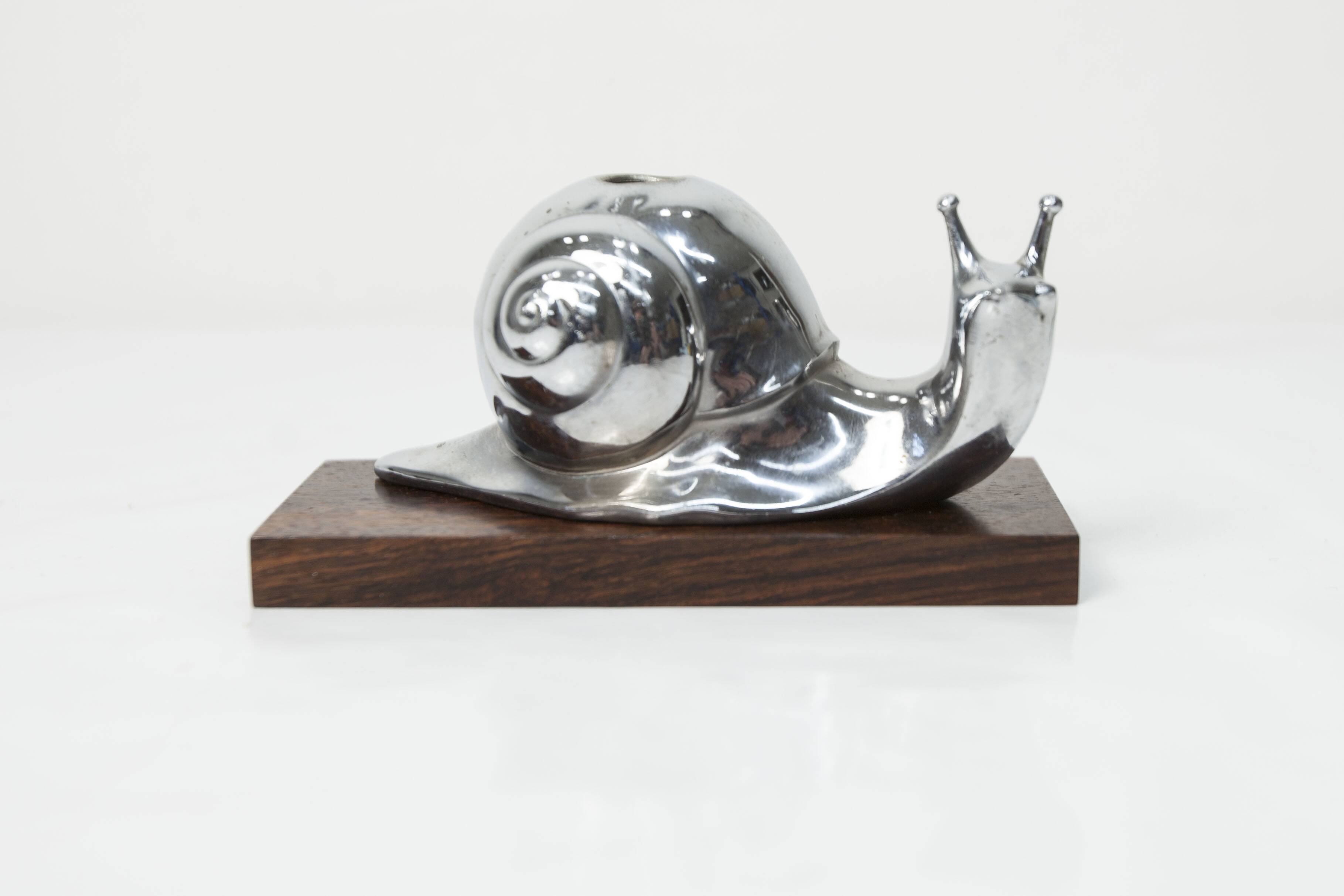 Silver snail candlestick on a teak base 1960