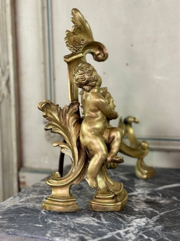 Paire de chenêts en bronze ciselé et doré d'après un modèle de Jacques Caffieri, Paris XIXème