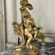 Paire de chenêts en bronze ciselé et doré d'après un modèle de Jacques Caffieri, Paris XIXème