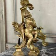 Paire de chenêts en bronze ciselé et doré d'après un modèle de Jacques Caffieri, Paris XIXème