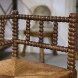 Pair of turned wooden corner chairs from the 1950s.
