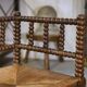 Pair of turned wooden corner chairs from the 1950s.